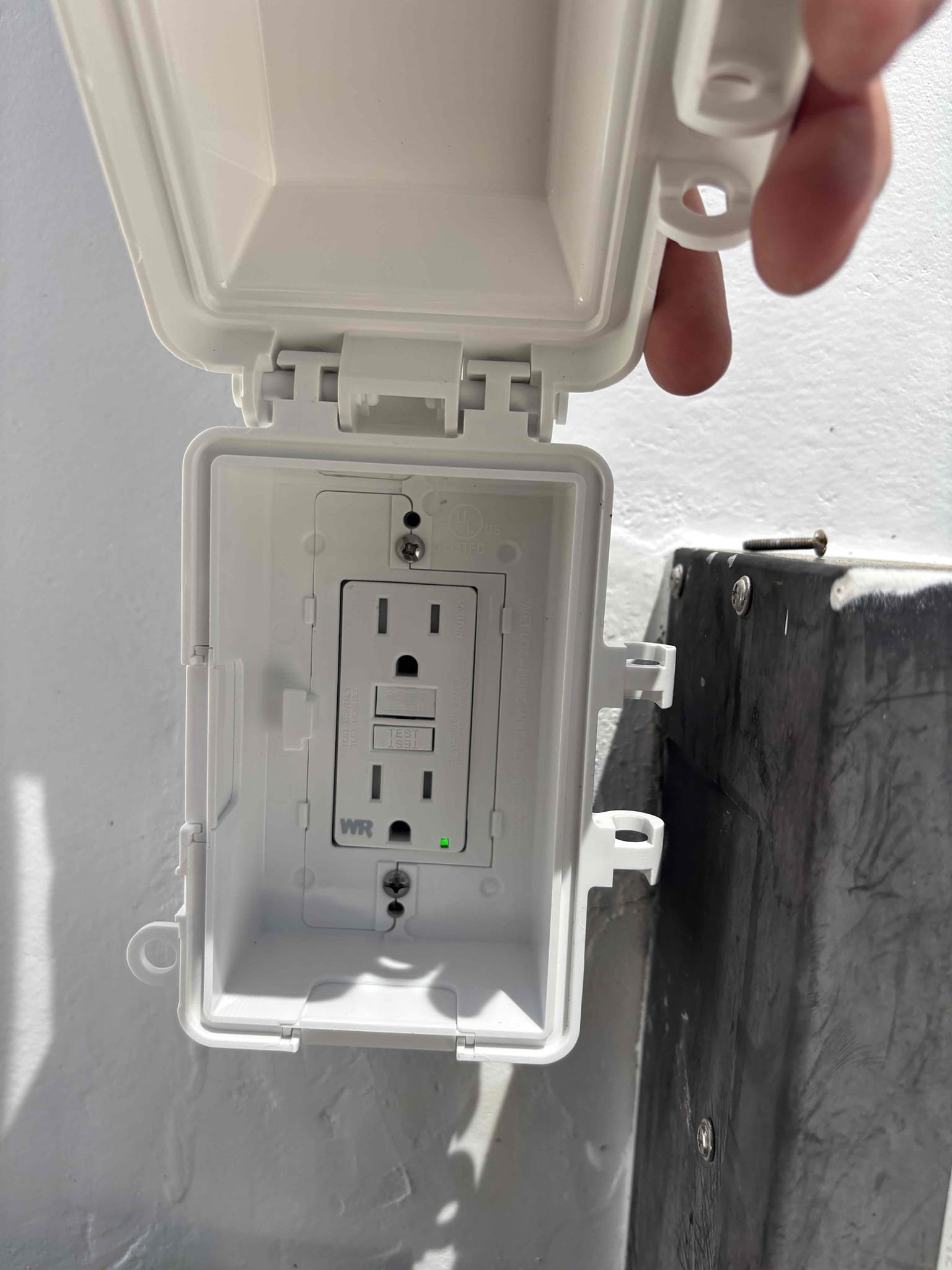 Replace GFCI on exterior, bathroom, and garage.
Rewire neutrals and ground in main panel so that neutrals are under their own screw. The grounds are installed properly per manufacture instruction. 
Uncover GFCI receptacle from stucco and install an extension ring for exterior receptacle to be accessible. 
Removed exterior light and placed a blank cover over the box 
