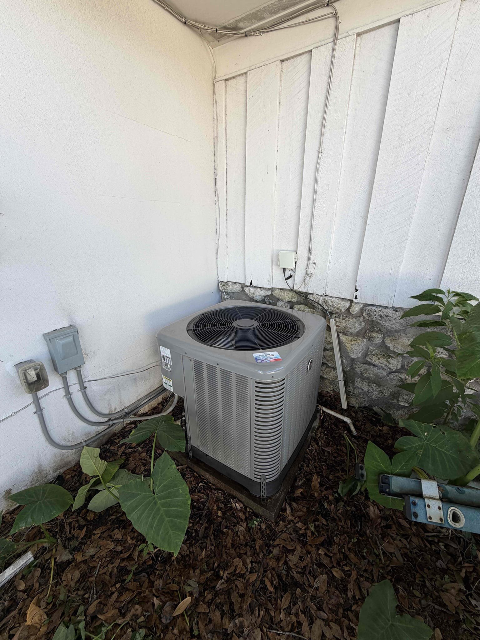 Upon my inspection, found severely clogged drain that was tripping the safety float switch. Also found evaporator coils are severely clogged, condenser coils dirty, and bare wires at the condenser disconnect causing the breaker to trip. 
Performed drain cleaning, removed faulty wires from disconnect, cleaned condenser coils, and performed Maitenence on system for first membership Maitenence. 
Capacitor is within factory range. Compressor amps are good. Fan motor amps were over its max rating due to dirty condenser coils. 

Client is aware of the severity of the evaporator coils and will schedule as soon as he is ready. 
System is cooling at this time with a 19° temp split. 

When we return to clean evaporator coils, we will re route the lineset connections and pvc connection to allow for filters to be installed directly underneath the coils. 