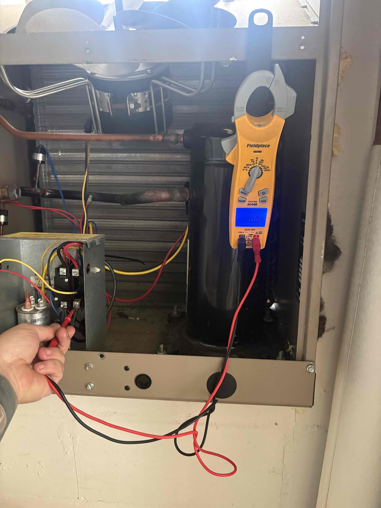 Upon arrival found breaker trip to condenser. Tested motor and compressor. Compressor tripping breaker due to internal scroll separated. Motor and unit will run with compressor unplugged. Once compressor plugged back in Compressor pulls high amps/not pumping than trips breaker. Will need to install new compressor along with 5.5lb 410a. Unit is currently down until parts ordered and repair scheduled. 

Home owner has been through several compressors. Possibility that previous compressor shards from scroll still in system which can cause new compressor to fail. 

Pancake air handler located in ceiling access in utility closet. 
