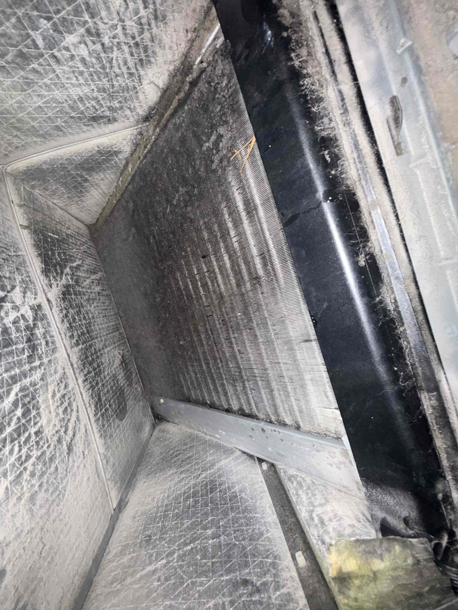 On arrival found unit leaking water due to impacted evap coil. Pulled and cleaned coil. Wiped down air handler. Replaced weak capacitor. Filled unit back to factory specs. Performed maintenance on system. Unit cooling properly  at this time .