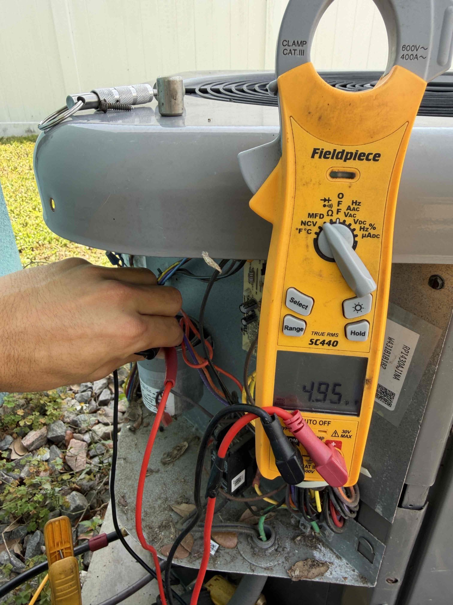 Upon my inspection, found the secondary safety switch in the emergency pan was tripped with water. System does not have a primary safety float switch. Performed a drain cleaning on system. Added a primary safety float switch. Checked pressures and found system slightly low on refrigerant. Added 1 pound of refrigerant. As part of first Maintenence, cleaned condenser coils. System was cooling with a 16° temperature split. It is now cooling with a 18° temperature split. Tested drain line with 1 gallon of water. System is cooling and drain draining as best as it can at this time.

Tested capacitor is within tolerance limits. Checked amp draw on compressor. Checked amp draw on condenser fan motor and found the fan motor is over amping. 