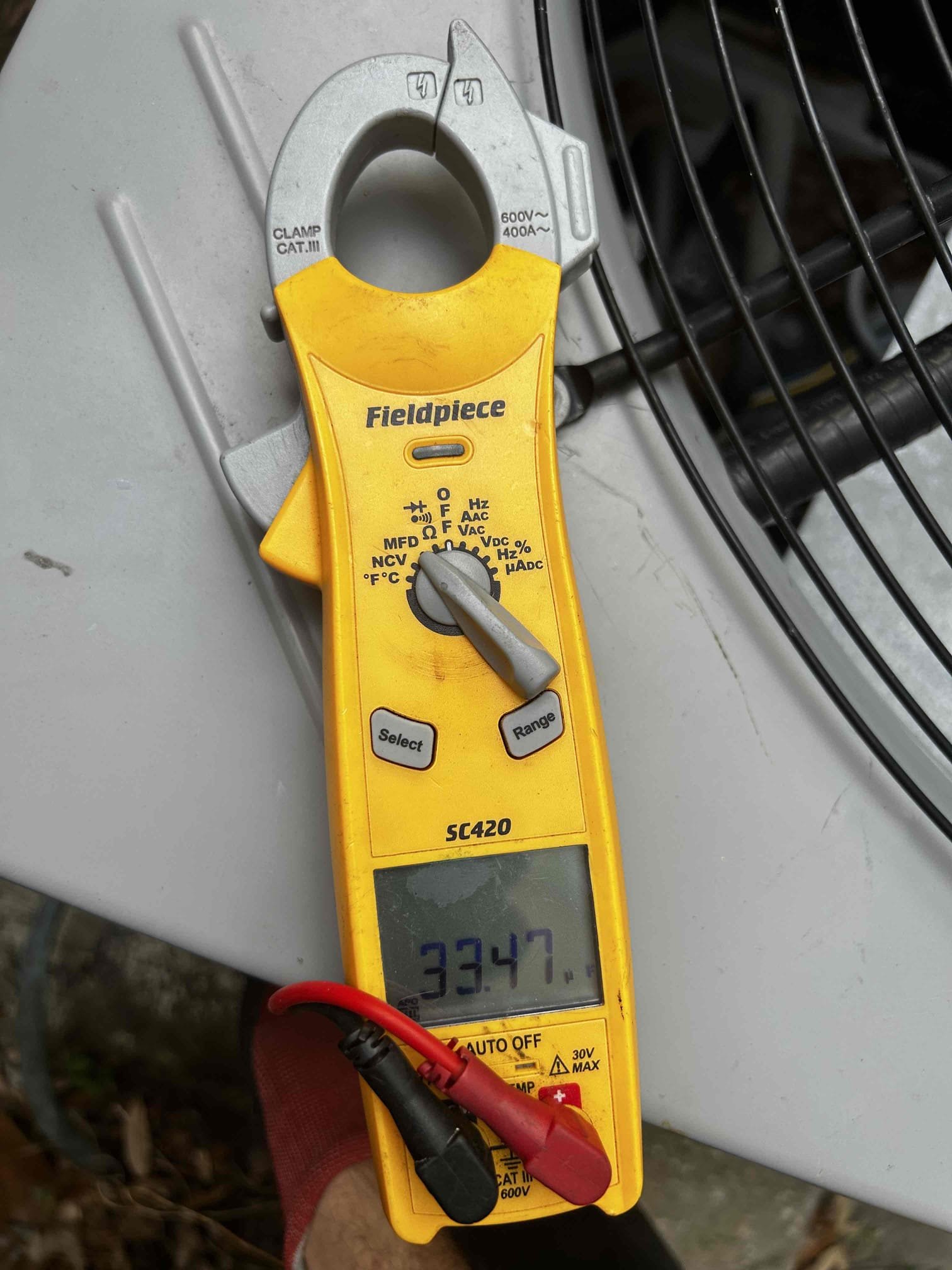 Upon arrival, I started by checking the temperature difference between the supply and return air, and I recorded a 16–17° temperature split.

Moving on to the electrical inspection, the system is operating properly overall. There is no over-amperage on the indoor air handler motor, outdoor condenser fan motor, or compressor. Both high- and low-voltage connections are properly secured with no signs of shorts, burnouts, or electrical damage.

I tested both the indoor and outdoor capacitors and found that both are reading below manufacturer specifications and are heavily rusted. I discussed my findings with the homeowner, and she agreed to move forward with replacing both capacitors.

While checking refrigerant pressures, I found that the readings are currently outside of manufacturer specifications. Further diagnosis will be performed during the follow-up repair appointment next week to confirm the exact issue.

I also performed a drain line treatment to ensure the condensate drain is fl