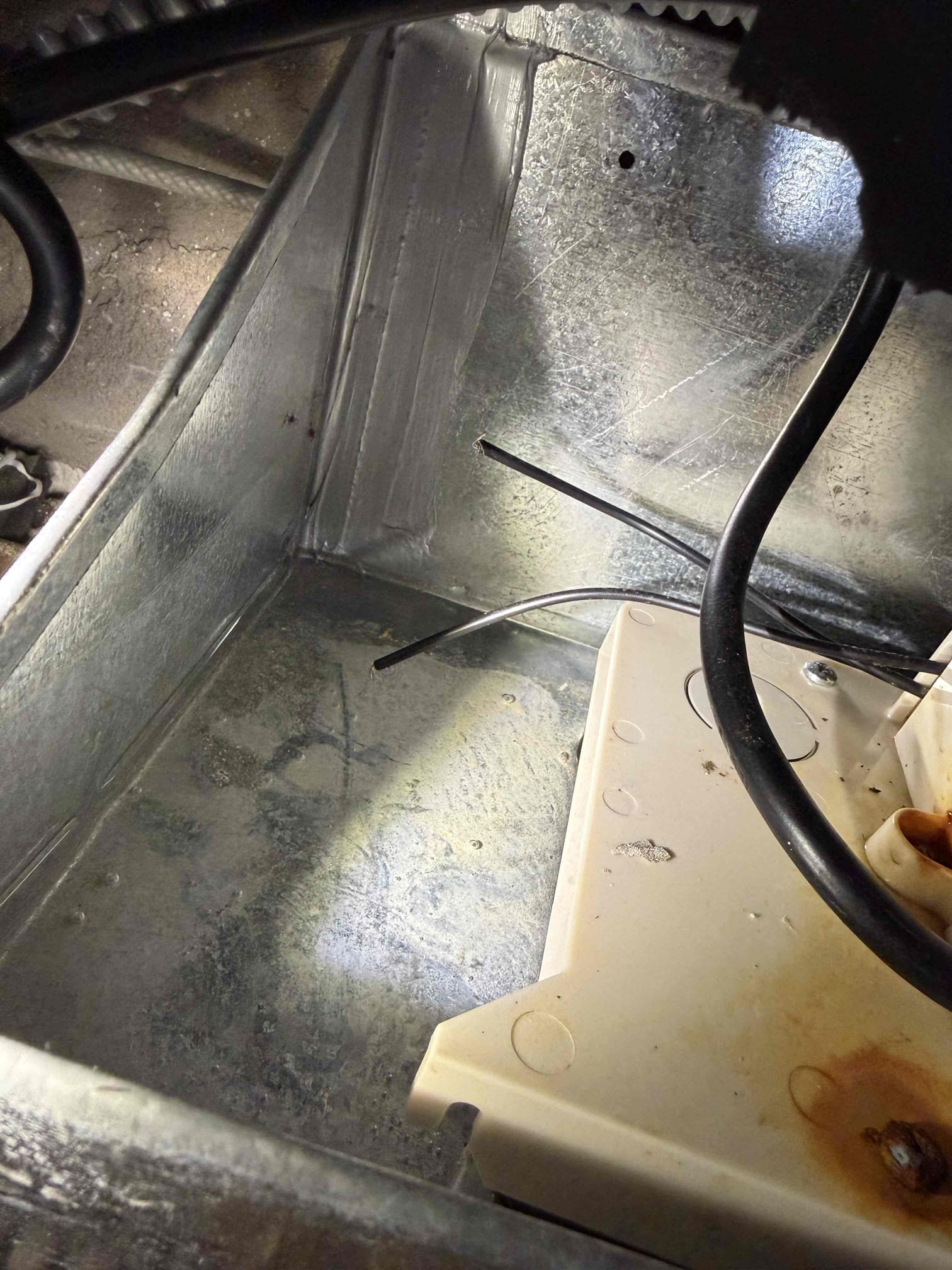 Client states that the building workers just did something with the chiller pipes. Upob my inspection, found the outlet that the condensate pump was plugged into Lost one leg of power due to a wire nut that has been knocked loose. One of the wires was disconnected. As a result, the pump flooded itself and also shorted out. 
System needs the outlet re wired and a new condensate pump. Client paid for repairs and will speak with Jeff to reimburse him. System is now cooling and draining properly. 