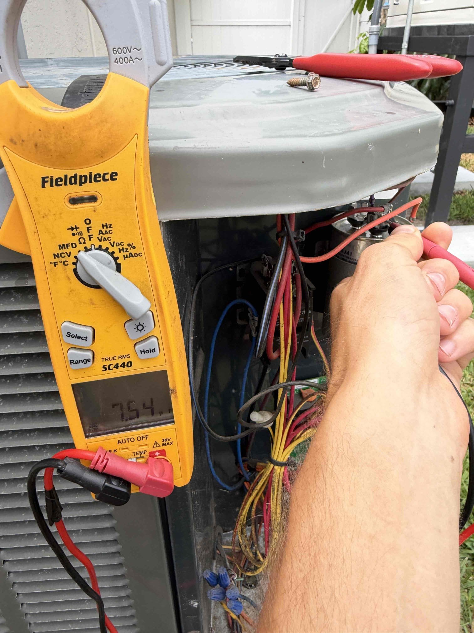 Client states unit is not cooling but thermostat is on. Upon my inspection, found clogged drain line and the safety float switch was tripped. Performed a drain cleaning/ treatment. Started up system and found compressor is pulling high amps. Inspected condenser coils and found dirty coils. Pressures indicate too much refrigerant in system. Client says they had compressor replaced last year by another company. It appears that the best practices installing a compressor were not followed based on copper connections and the amount of refrigerant in the system. 

Cleaned/ treated drain line and primary drain pan. 
Chemical cleaned condenser coils with fan removed. 
Adjusted refrigerant charge to achieve proper subcool. 

Found condenser disconnect is damaged and requires replacement. Will return later this week to replace. 

Compressor pulls high amps are starting to up. Recommended soft start kit to reduce amp draw and prolong the life of the compressor. 
