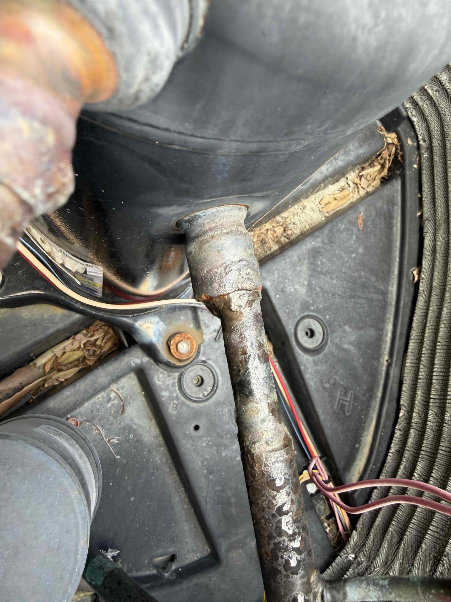 Client states unit is not cooling but thermostat is on. Upon my inspection, found clogged drain line and the safety float switch was tripped. Performed a drain cleaning/ treatment. Started up system and found compressor is pulling high amps. Inspected condenser coils and found dirty coils. Pressures indicate too much refrigerant in system. Client says they had compressor replaced last year by another company. It appears that the best practices installing a compressor were not followed based on copper connections and the amount of refrigerant in the system. 

Cleaned/ treated drain line and primary drain pan. 
Chemical cleaned condenser coils with fan removed. 
Adjusted refrigerant charge to achieve proper subcool. 

Found condenser disconnect is damaged and requires replacement. Will return later this week to replace. 

Compressor pulls high amps are starting to up. Recommended soft start kit to reduce amp draw and prolong the life of the compressor. 