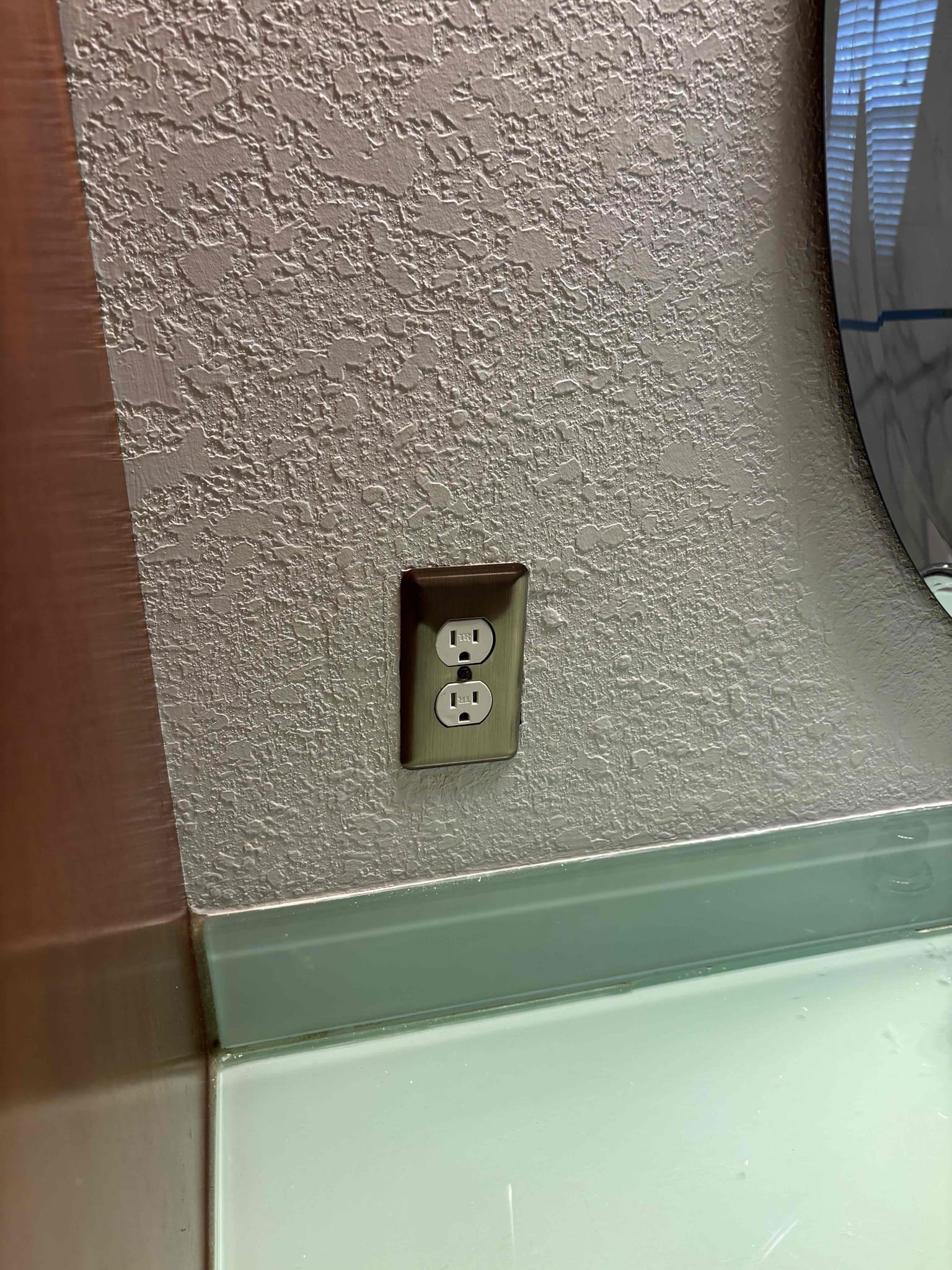 Install ac disconnect at air handler 
Install GFCI receptacle in kitchen for code compliance 
Install new receptacle for microwave to remove miss wired and back stabbed receptacle 
The kitchen outlet had a ground connection not a hot and neutral reversed rewired receptacle properly 
Install cover plate on receptacle in bathroom that was missing 
Removed double tapped connection in panel for the surge protector that was no longer functioning installed a Knock out seal in panel  