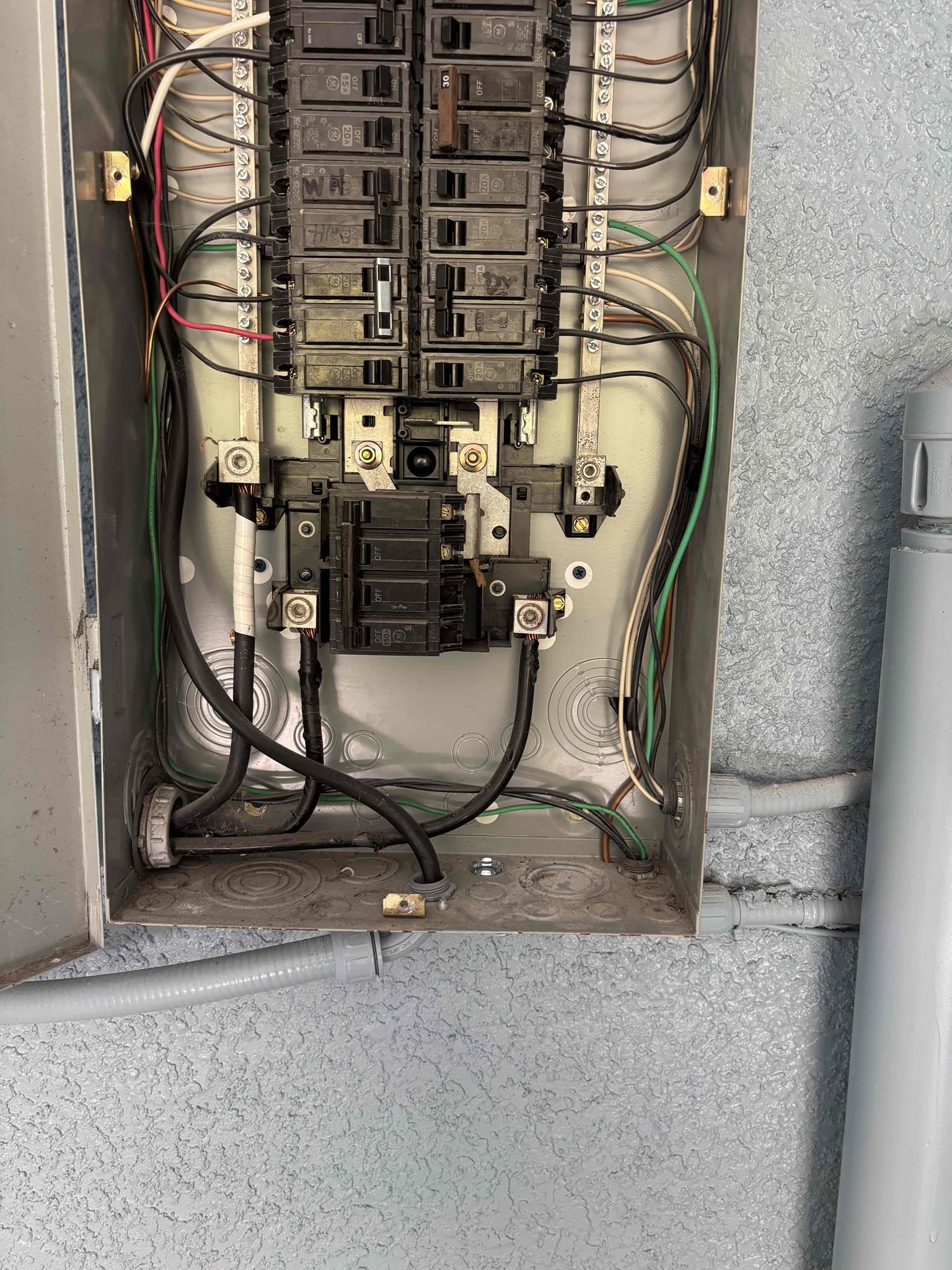 Install ac disconnect at air handler 
Install GFCI receptacle in kitchen for code compliance 
Install new receptacle for microwave to remove miss wired and back stabbed receptacle 
The kitchen outlet had a ground connection not a hot and neutral reversed rewired receptacle properly 
Install cover plate on receptacle in bathroom that was missing 
Removed double tapped connection in panel for the surge protector that was no longer functioning installed a Knock out seal in panel  