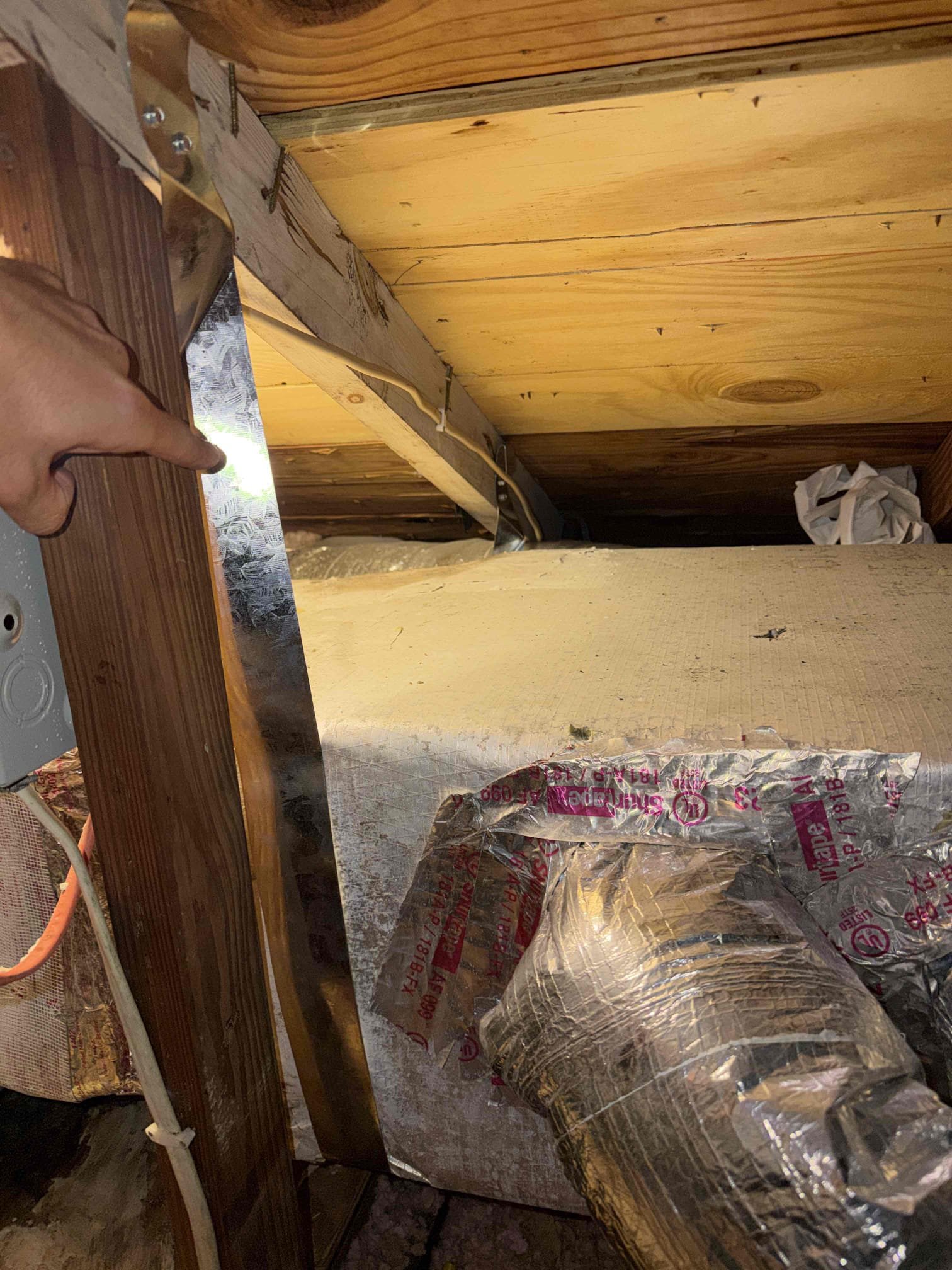 Client states that air bnb apartment #1 does not go down past 78°. Upon my inspection, found system supply and return plenums are detached from the air handler and as a result sucking in attic air and supplying cold air to the attic. This is causing the system to run inefficiently. Recommended re sealing the supply and return plenums to keep the air flow within the apartment. 
Checked system pressures and it appears that the system may be slightly over charged with refrigerant. However the system has a good 18° temperature split. 

The installation of this system is poor and it appears that the company who installed it did not follow proper installation procedures. For example, the secondary emergency drain pan is too small for the air handler and is not up to code regulations. 

Scope of work today:
- Re strap up duct plenums 
- Re Seal plenums to unit
**No guarantee on system performance after repairs due to poor installation procedures from another company.**

System is cooling at t