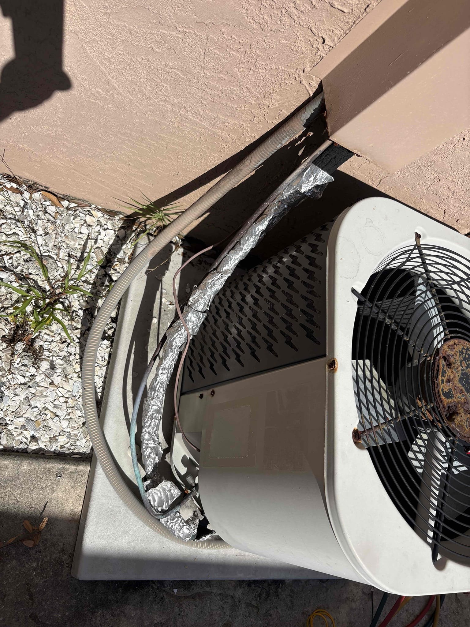 Home owner states unit is running but not cooling. 

Diagnostic 
-failed outdoor capacitor 
-pitted and rusted contactor

Further Diagnosis 
-outdoor motor and grate heavily rusted 
-no outdoor shutoff (code item)
-outdoor insulation deteriorated and taped 
-indoor air handler coils & pan severely rusted 
-indoor blower assembly impacted with bacterial growth 
-air handler does not have hanging kit (code item)

Went over repair option to get system running. Explained there could be further diagnosis needed after repairs and no guarantees due to current system condition. 

Went over options for replacing 2T unit or adding mini split 

No repairs made at this time. Home owners will discuss options. 