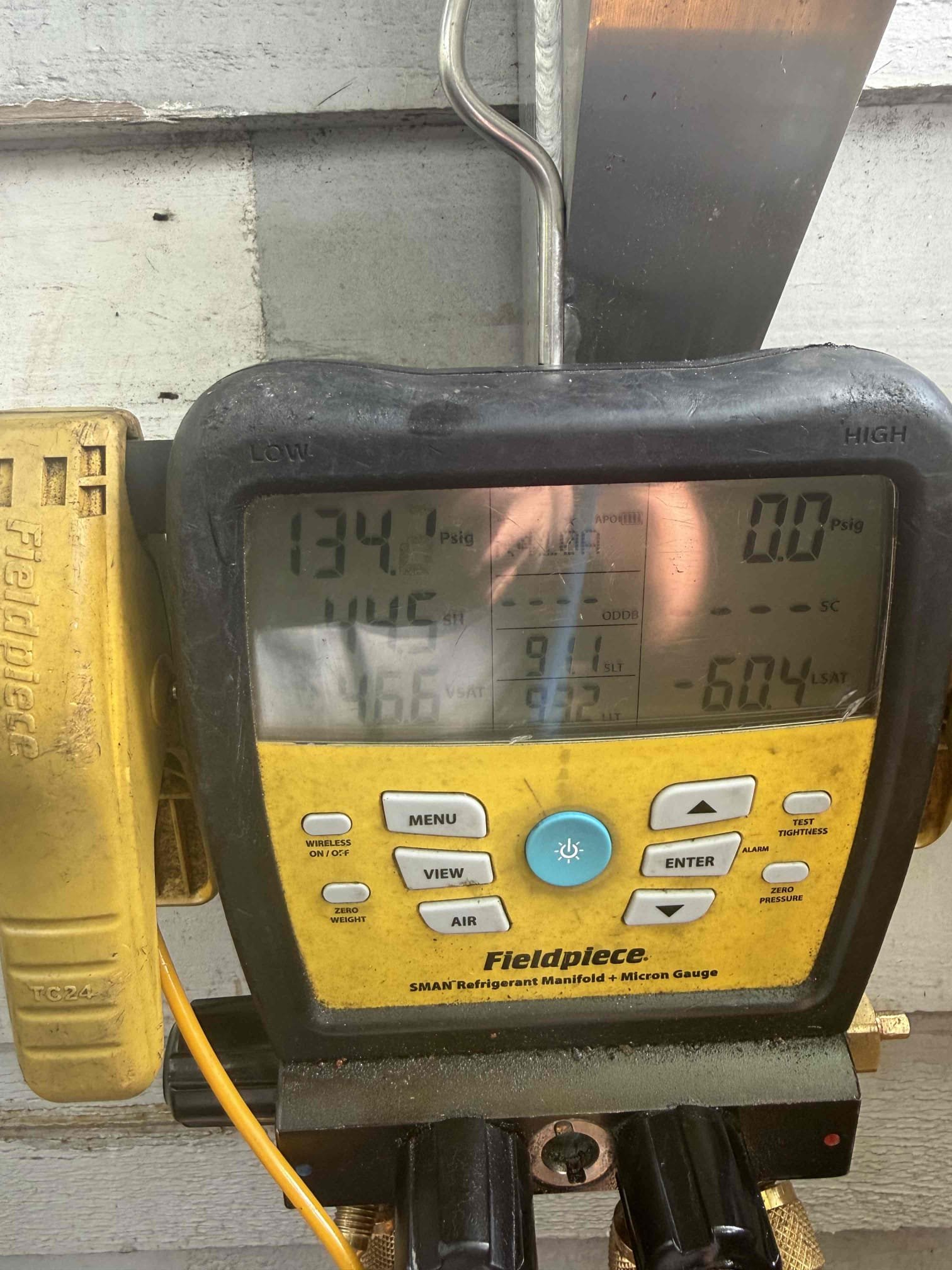 On arrival found mini split not cooling due to low refrigerant levels. Performed leak search on system and found evap coil for downstairs leaking. Added refrigerant back to factory specs to allow system to cool. Both head units cooling properly at this time. 
