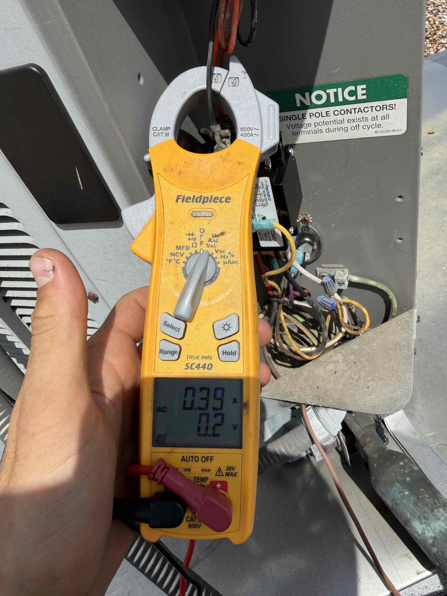 Upon my inspection, found capacitor, contactar, and wiring in the condenser burnt up and faulty. 
Replaced capacitor, contactar, and new connectors on wiring. 

System is cooling at this time with a 20° temp split. 
System is a 2010 and furnace is from 1992. Recommended that client prepare for new system due to age and condition. Sending quote over for replacement by tonight. 

No guarantee on repairs today due to system age and condition. 