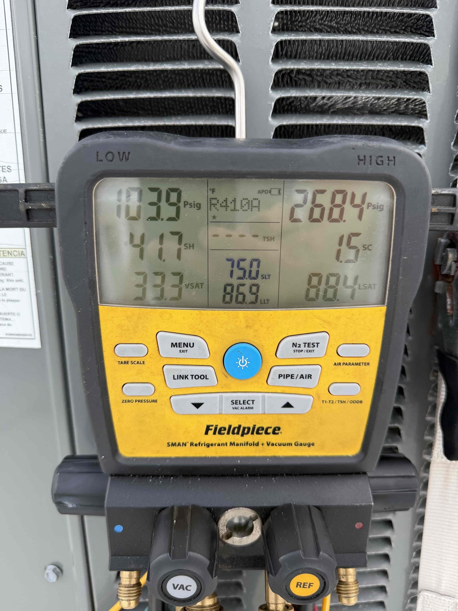 Upon my inspection, found a clogged drain line on the downstairs system. Performed a drain cleaning and treatment. 
Downstairs system is cooling with a 20° temperature split at this time. 

Inspected the upstairs system and found system is low on refrigerant with a 10° temperature split. Found leak in the evaporator coils/txv. 
Quote is being sent to replace the evaporator coils and txv under parts warranty. Charged system with refrigerant to keep system cooling until we can return. 