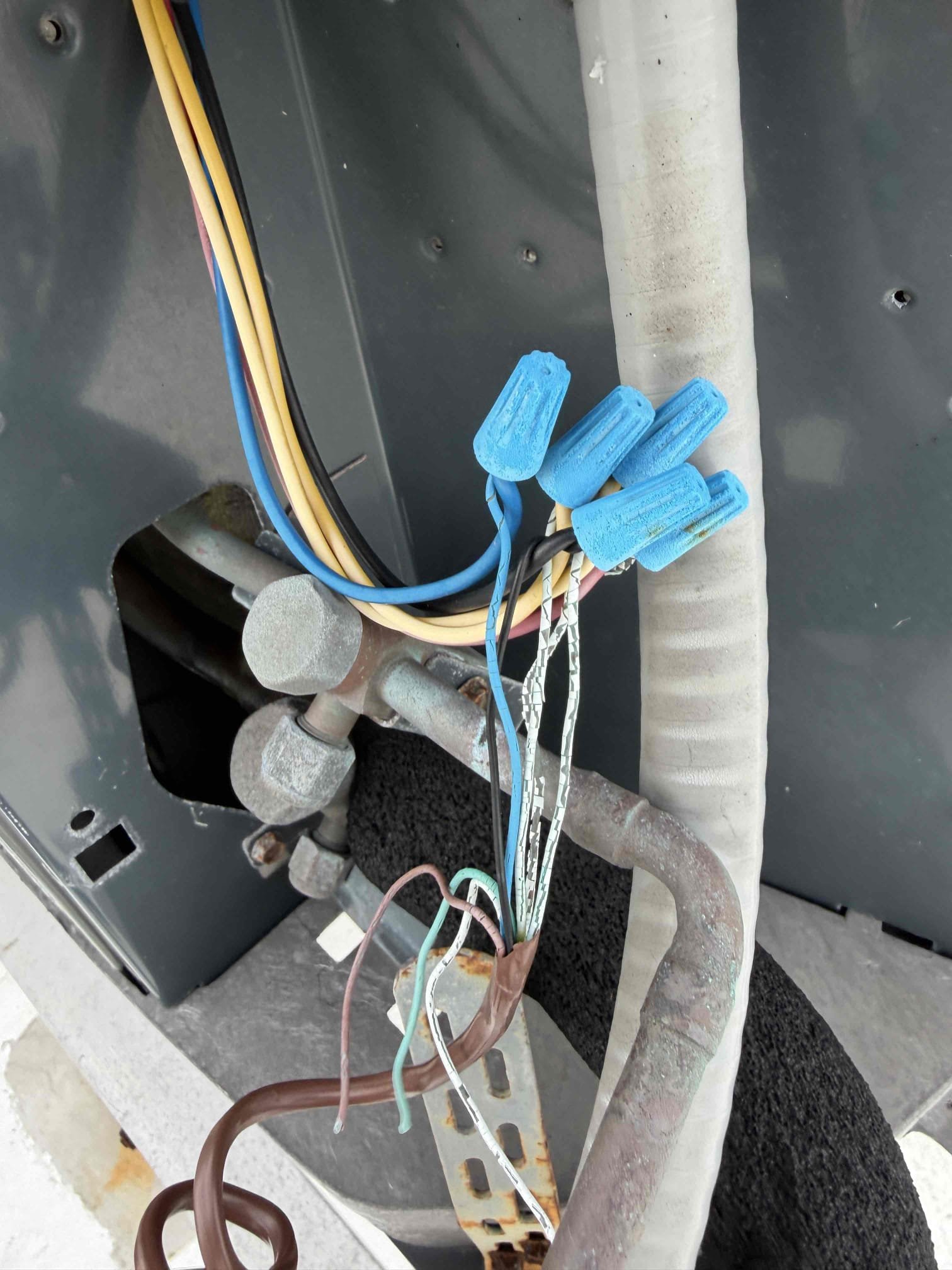 Upon my inspection, found a clogged drain line on the downstairs system. Performed a drain cleaning and treatment. 
Downstairs system is cooling with a 20° temperature split at this time. 

Inspected the upstairs system and found system is low on refrigerant with a 10° temperature split. Found leak in the evaporator coils/txv. 
Quote is being sent to replace the evaporator coils and txv under parts warranty. Charged system with refrigerant to keep system cooling until we can return. 