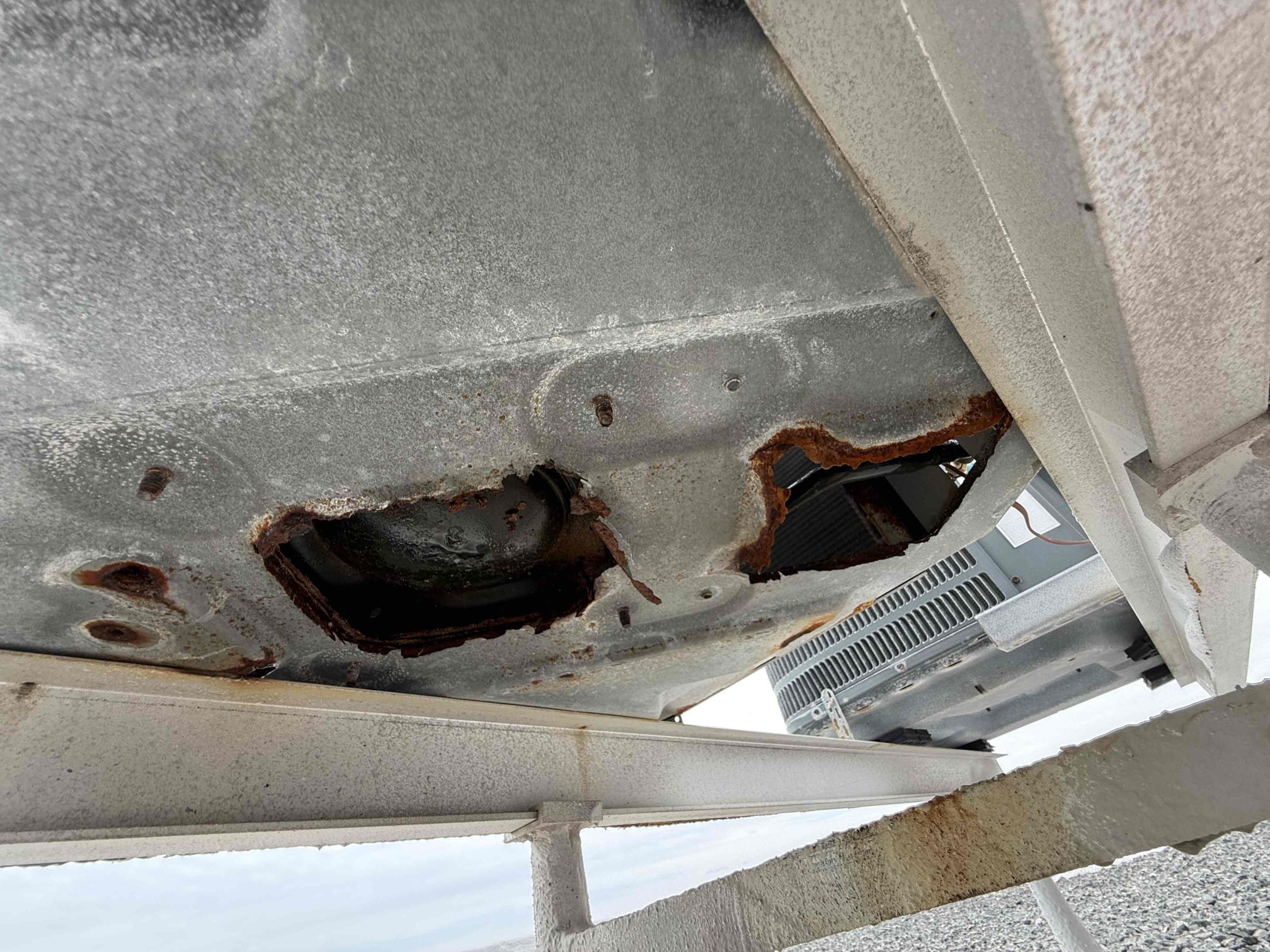 Reason for call:
No cool 

Equipment:
2012 Lennox 2 ton straight cool 
Open draw vertical 
Condenser on roof 

Summary:
Found unit in very poor condition. Unit was low on refrigerant charge. Contactor was burnt and pitted, dual capacitor had weak readings and rusted terminals. Condenser was rusted out compressor is about to fall through the bottom of the unit. Thermostat was unresponsive and Redding incorrect temps. 

Solution:
Offered a repair and a replacement quote real estate agent will present to owner. 