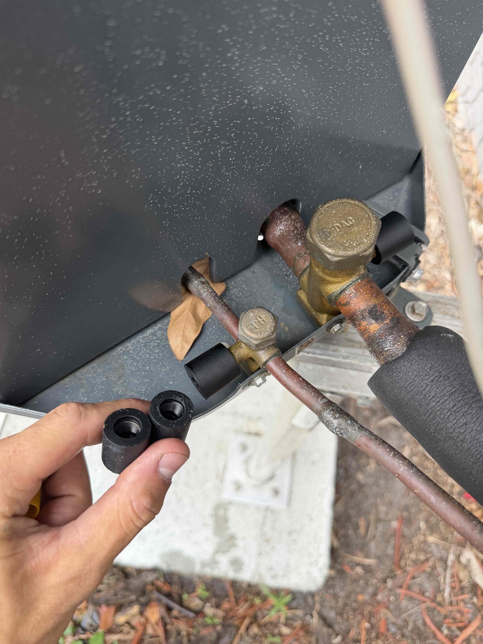 Client stated that inspector for selling the home pointed out a few issues. I was told the orange wire in the air handler closet needs to be addressed as it is not capped off and stored away so that it cannot be accessed easily, holes in the ceiling above the air handler need to be sealed off and the unit kept turning off a couple degrees before the desired temperature. 
Provided a quote for our electrician to come out and address the electrical issues and seal the ceiling holes for a total of $400 and client would like to have their own electrician come out. 

Found the system was shutting off due to low pressure cut off switch. System is low on refrigerant. Performed leak search and found only leak at the schrader core valve at the condenser. Repaired this leak and charged system with refrigerant to bring back to factory spec. 

System is now cooling with a 20° temperature split. 