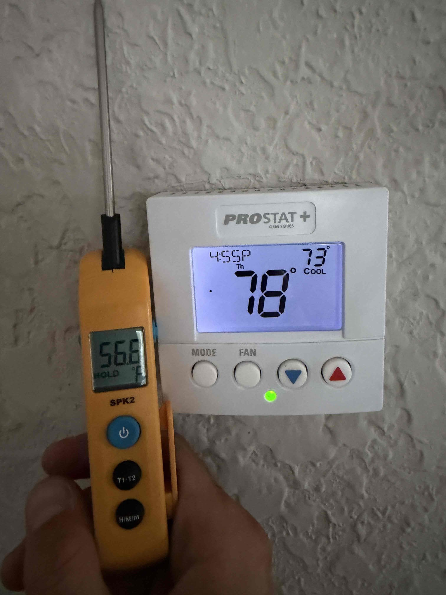 Client stated that inspector for selling the home pointed out a few issues. I was told the orange wire in the air handler closet needs to be addressed as it is not capped off and stored away so that it cannot be accessed easily, holes in the ceiling above the air handler need to be sealed off and the unit kept turning off a couple degrees before the desired temperature. 
Provided a quote for our electrician to come out and address the electrical issues and seal the ceiling holes for a total of $400 and client would like to have their own electrician come out. 

Found the system was shutting off due to low pressure cut off switch. System is low on refrigerant. Performed leak search and found only leak at the schrader core valve at the condenser. Repaired this leak and charged system with refrigerant to bring back to factory spec. 

System is now cooling with a 20° temperature split. 