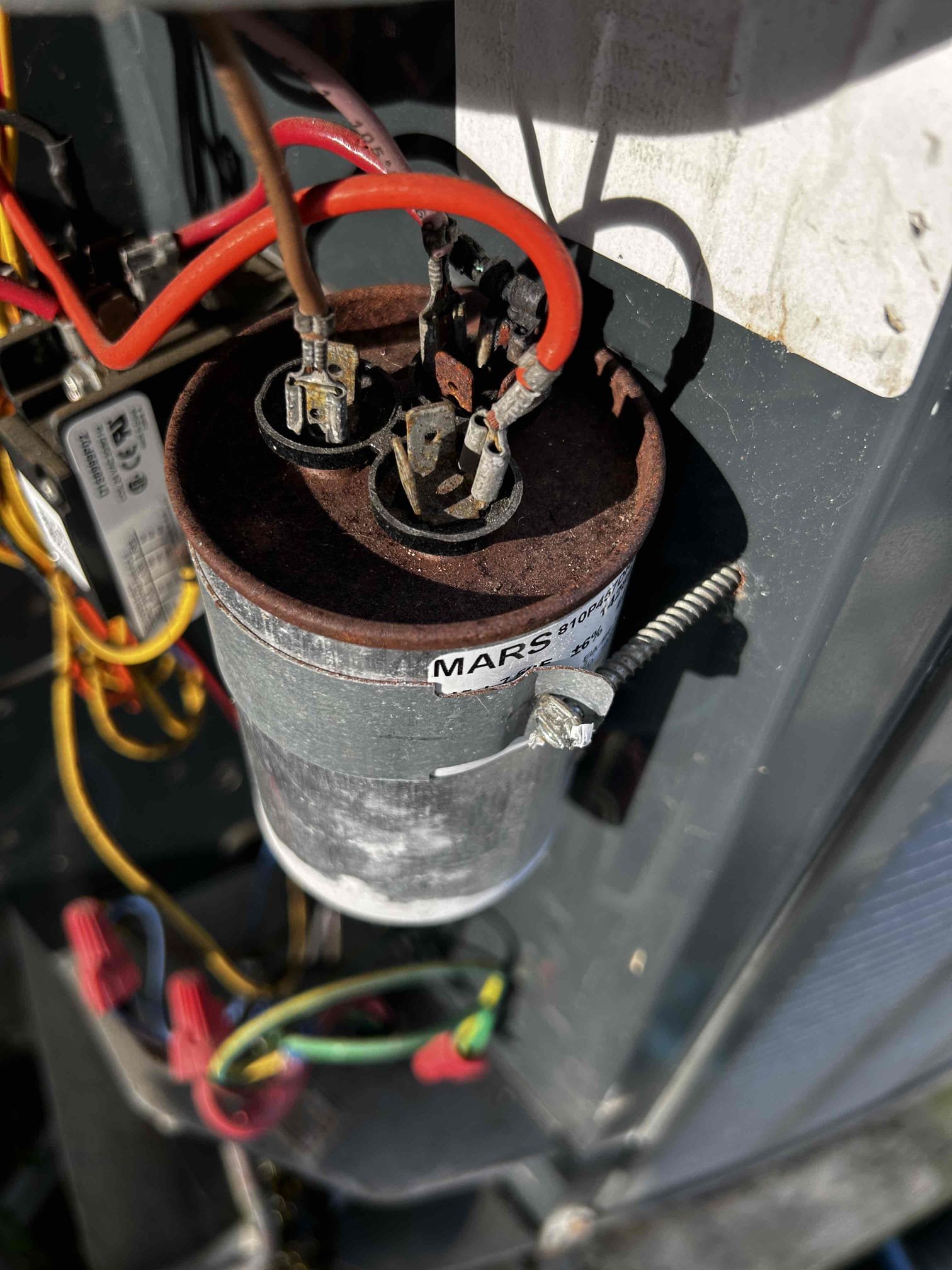 Upon arrival, I began by checking the temperature differential between the supply and return air. The system was maintaining a 20°F temperature split, which is within a healthy operating range.

Next, I inspected the refrigerant cycle. Pressures and temperatures were operating within normal specifications, and there are currently no signs of refrigerant leaks or restrictions. The refrigerant system is functioning properly.

I then completed an electrical inspection. Both high-voltage and low-voltage components are operating correctly, and all electrical readings were within acceptable ranges.

The primary recommendation at this time is to replace the capacitor. The capacitor is not testing below its rated microfarad (µF) value but is showing signs of rust and deterioration. Replacing it proactively can help prevent future system interruptions and component failures.

During today’s visit, I performed a drain line treatment, condenser coil cleaning, and air handler inspection.

An addit