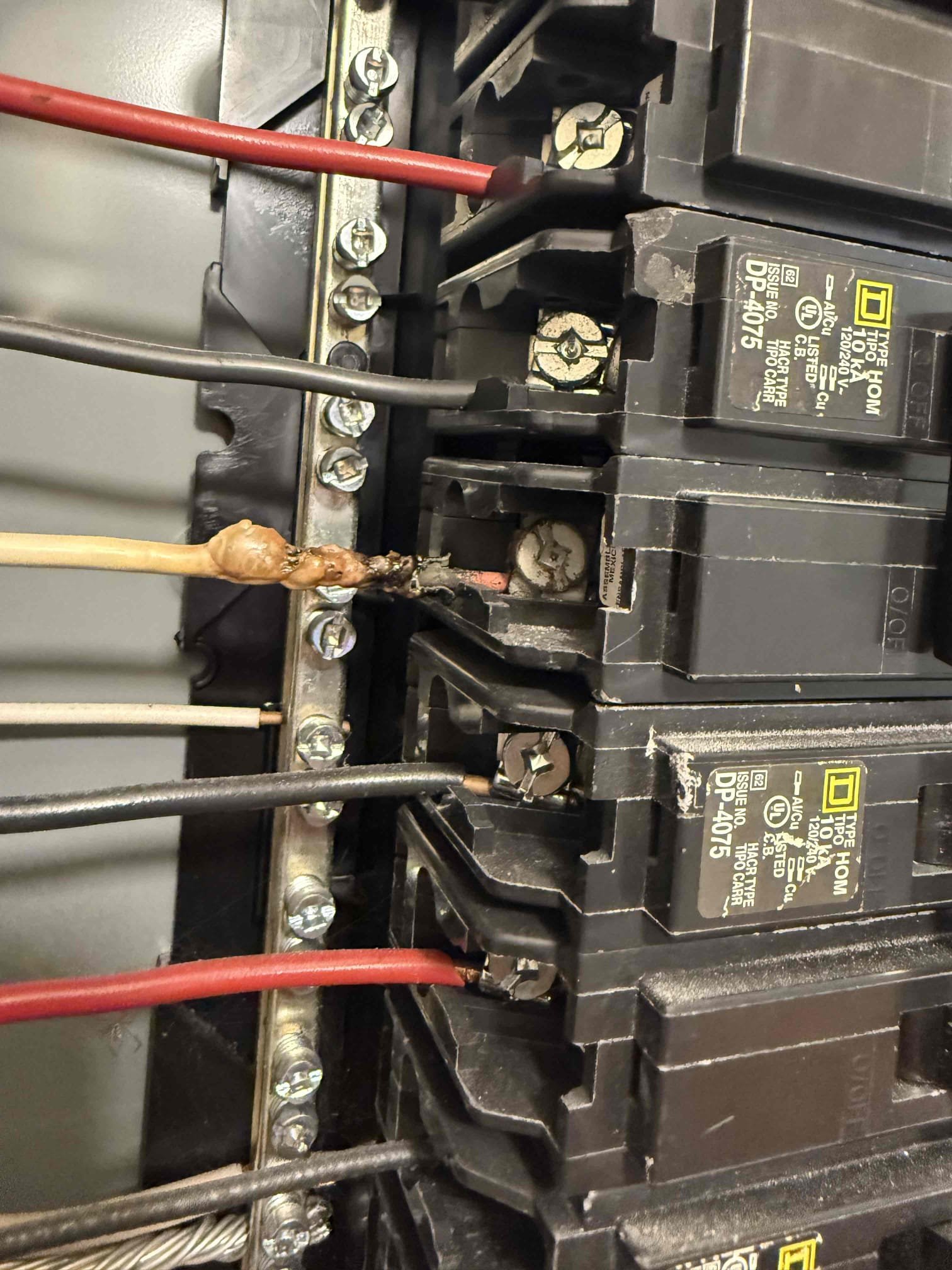On arrival found downstairs unit not cooling due to tripped breaker. Turned breaker on and heard arcing behind panel cover. Turned off power and removed panel cover. Observed loose connection causing wire to burn. Replaced breaker and cut out bad wire. Start and test. Amp draws good. Temp split good. Pressures good. Capacitor in range. Unit cooling properly at this time. 