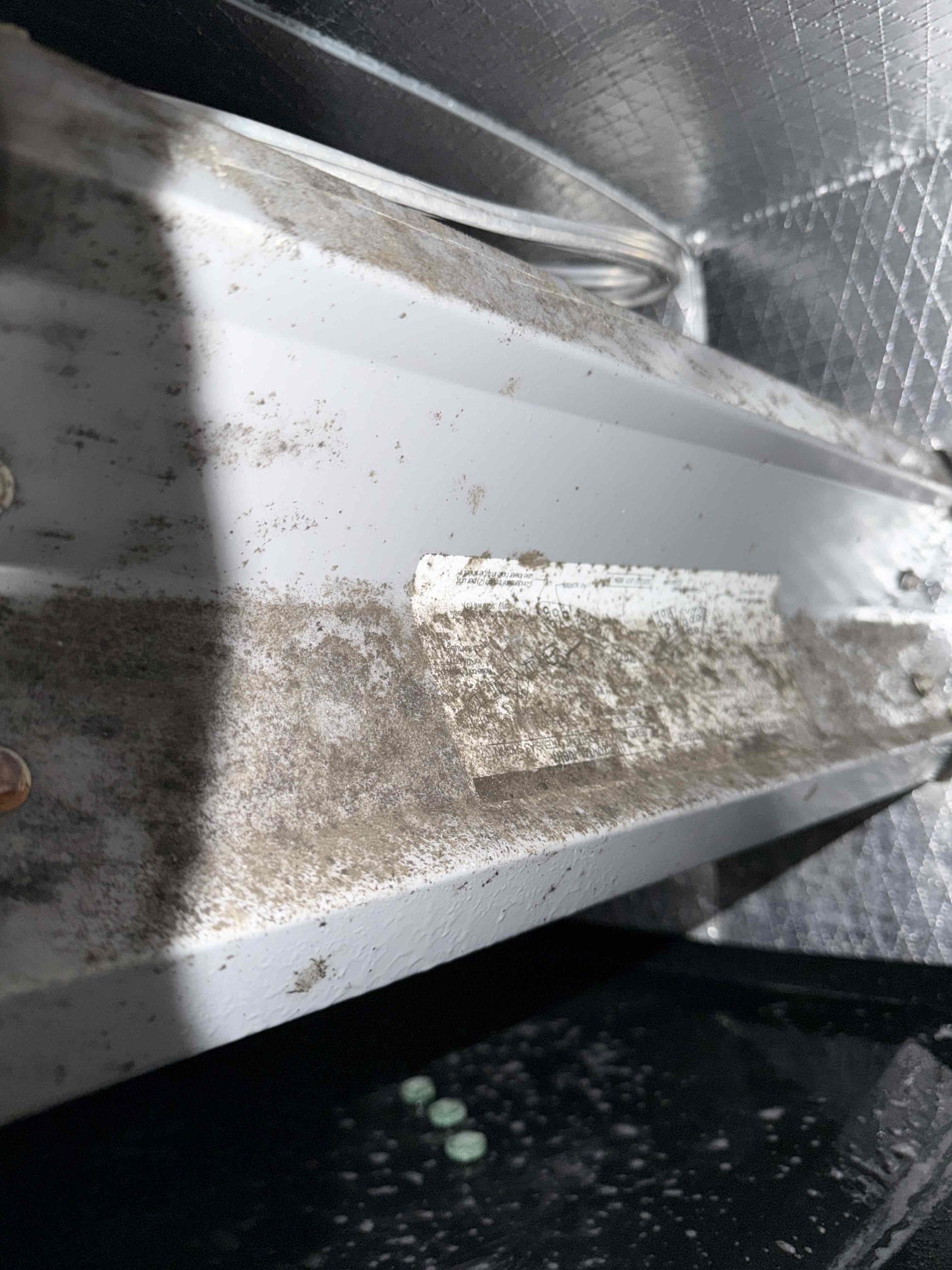 Upon my inspection, found air handler in garage drenched with water. Found clogged drain line. With drain line clog, also found drain is missing a p trap, shares a line with a secondary safety pan drain line which is not code compliant, non existing primary safety float switch, and the existing drain line exit is causing water to erode the home concrete wall. 
Informed client of these drain concerns. 

Cleaned and treated drain line and primary drain pan. Client would like to hold off on all other repairs at this time. I informed them I cannot guarantee this drain cleaning due to the fact that the drain line is not up to code and not performing as it should. 

Client signed up for Maitenence plan and I performed first Maitenence today. Cleaned condenser coils, checked amp draws on motors and compressor. Compressor is over amping on start up and at risk of premature failure. Found system start capacitor is weak and out of factory range tolerance. This capacitor is at risk of failure. Am