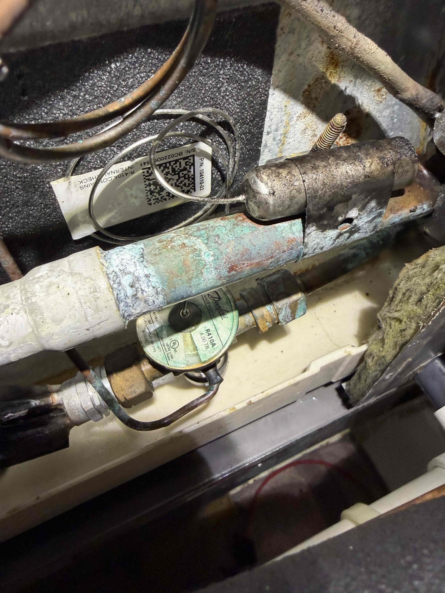 Upon my inspection, found air handler unit leaking water out of the drain pan and into the return plenum. Explained to client that we have to perform a professional drain cleaning and treatment first and then we can determine if the water is escaping the unit from other areas. At this time, I performed a drain cleaning and treatment. I did not observe any pan cracks or drain cracks at this time. Let client know if the issue persists, we will need to return to see where this water is coming from. 
System is cooling at this time with 20° temperature split and good pressures. 
Client signed up for our Maitenence plan today. Did not perform full Maitenence at this time. 