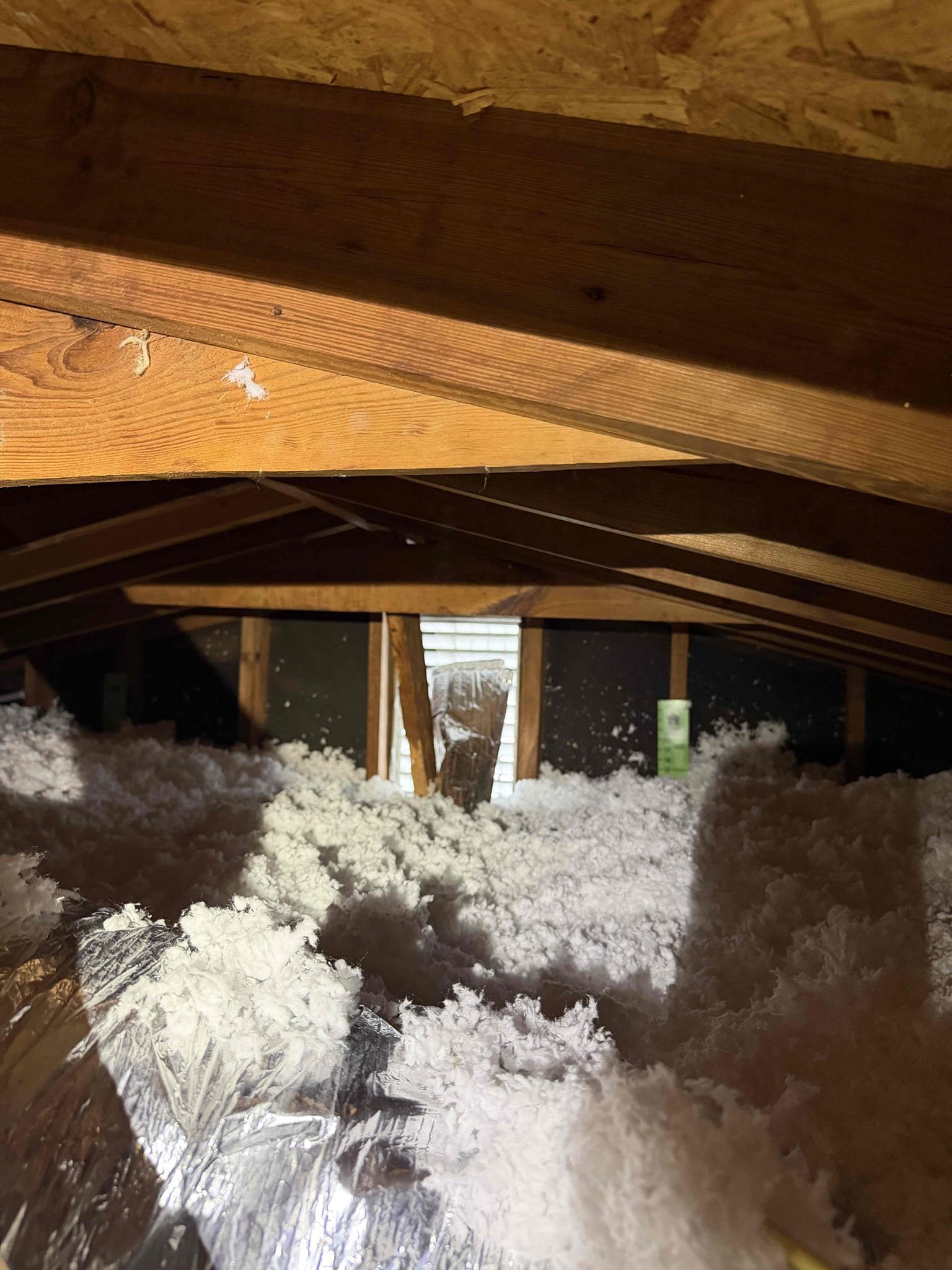 Paw my inspection found system working properly. However, system is sweating and ductwork is now sweating. Client had blown in insulation recently and shortly after there is now condensation issues on the duct system and air handler. 
Upon my inspection, I found the ductwork is buried under insulation, which is reducing the temperature below dewpoint, causing the ductwork to sweat and air handler to sweat. I also found that the addict does not have proper ventilation. We recommend strapping up all the ductwork, mastic ceiling, all the ductwork, and installing a gable vent exhaust fan. Sending quote for both.
Waiving the $95 service fee moving forward with either quote
