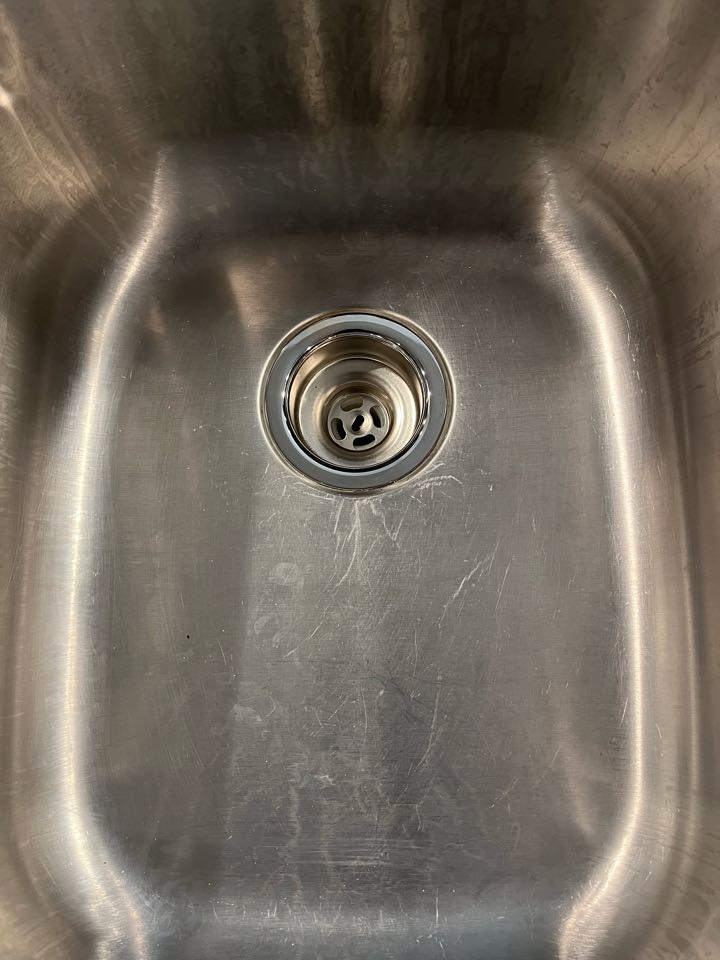 Replaced the basket strainer in kitchen sink to fix the leak under the sink. 