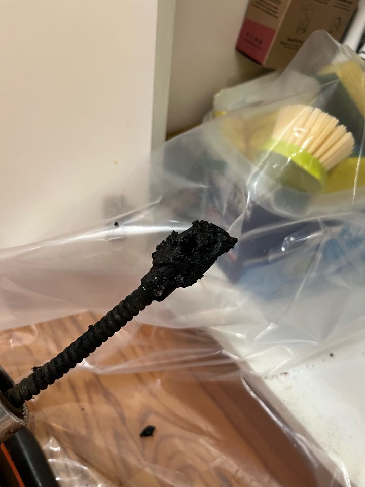 Ran sink machine through kitchen sink, drain and cleared stoppage