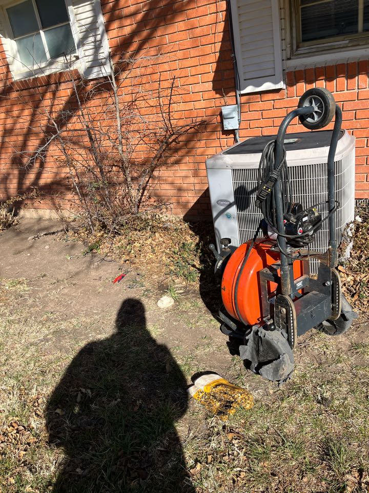 Ran sewer machine through outside cleanout and cleared stoppage