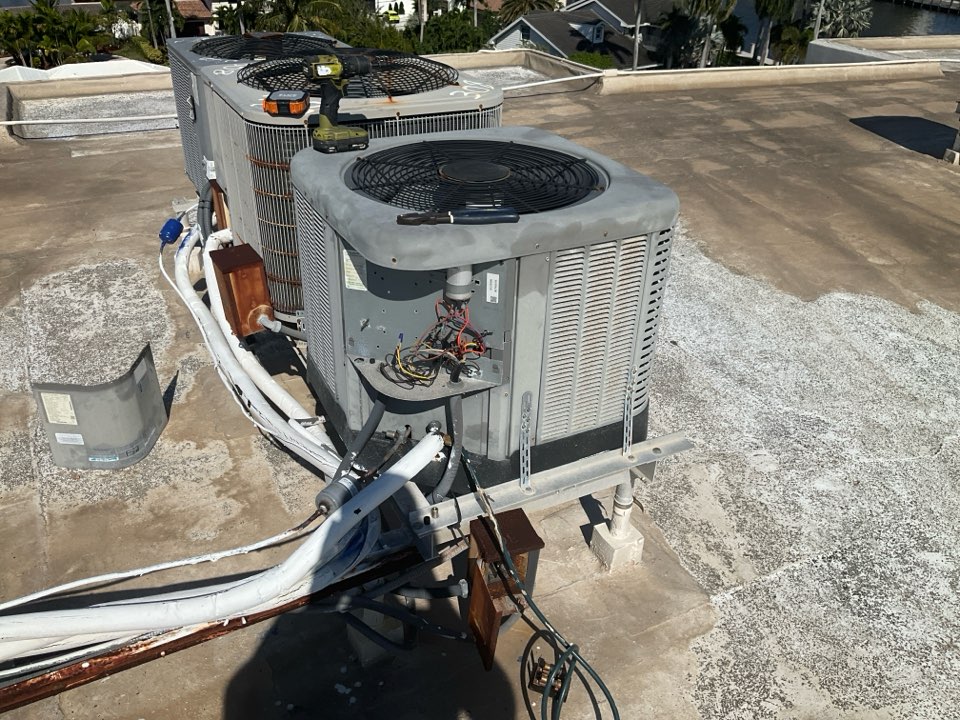 AC Service Call. Install new condenser coil for Ruud system. 