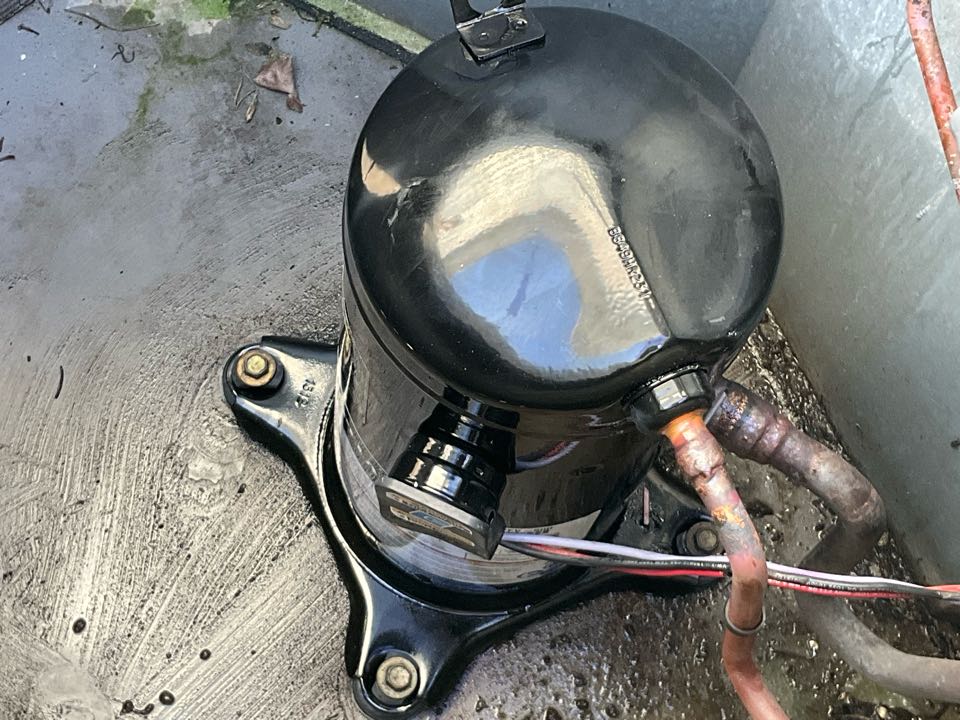 AC Service Call. Install new compressor for Ruud air conditioning system.