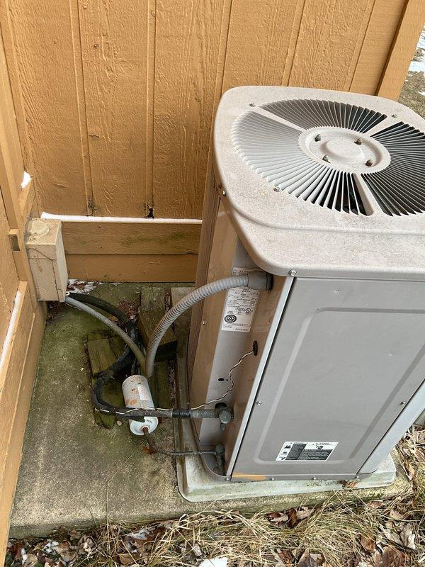 Responded to no-heat service call for rental property with 10+ year old Goodman AF92MPE075U3B direct vent forced air furnace. Diagnosed system cycling on/off without achieving setpoint temperature. Inspection revealed plugged condensate drain lines causing system malfunction. Cleared blockage, restored proper drainage function and verified normal heating operation before completing service.