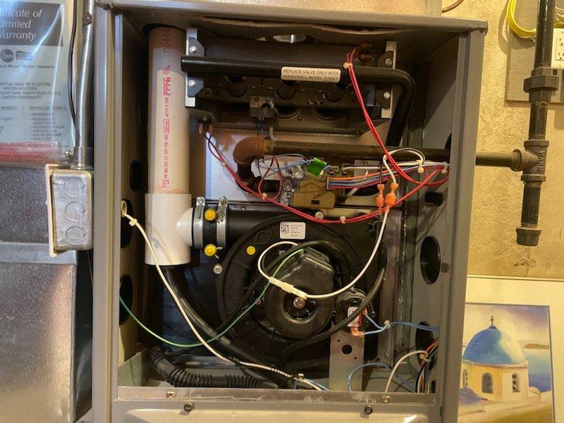 Responded to service call for a Heil furnace experiencing intermittent heat loss and complete failure. Diagnostic inspection revealed defective gas valve producing audible clacking sound when touched. Replaced faulty Honeywell SV9541 gas valve according to manufacturer specifications, ensuring proper connection of all electrical components. System now operating normally with consistent heat output.