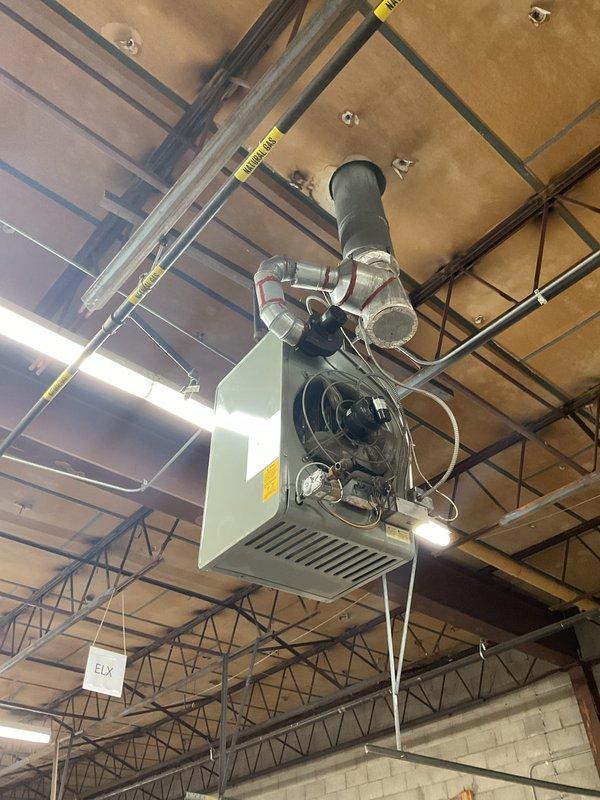 Serviced two ceiling-mounted heaters in commercial space. Diagnosed first unit making abnormal noise as having worn blower motor bearings requiring replacement. Second non-operational unit found with failed ignition control module and gas valve; replaced both components and verified proper operation. Both heating systems now functioning correctly with normal flame pattern and appropriate temperature rise.