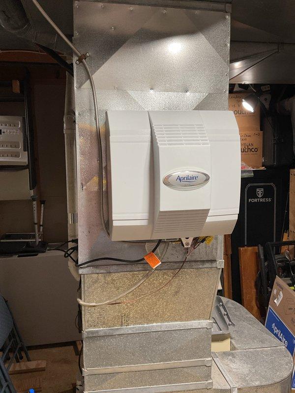 Successfully installed an Aprilaire power humidifier on the existing HVAC system in the utility room. Unit was properly mounted to the ductwork with all necessary electrical connections completed and verified operational.