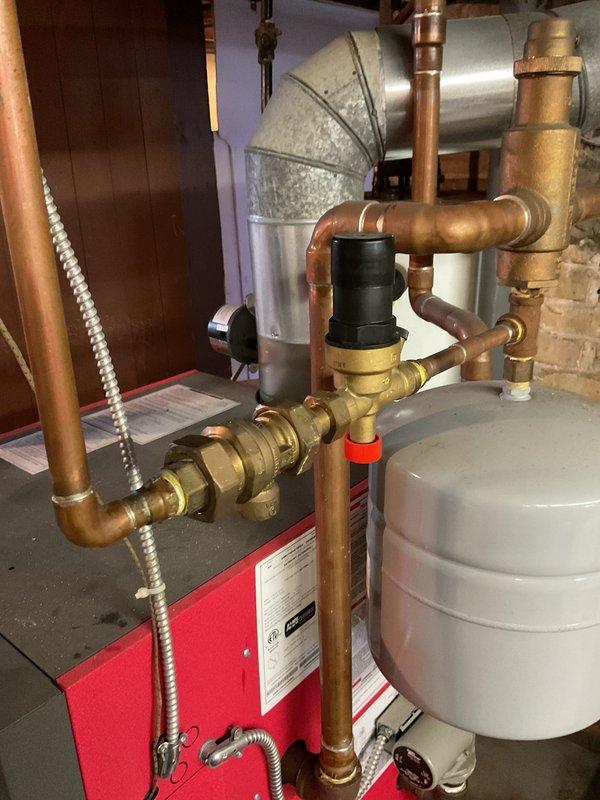 Diagnosed Crown boiler with low pressure (0-2 PSI) causing no heat in the residence. Performed system maintenance including cleaning the backflow preventer, restoring proper pressure to the boiler, and bleeding all radiators to restore proper heating function.