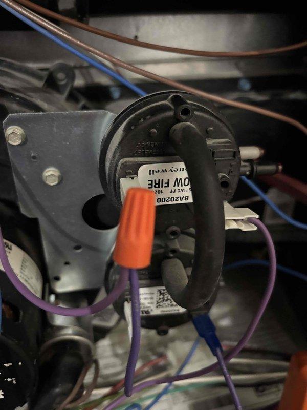 Responded to customer complaint of no heat after previous drain tap clearing. Multimeter diagnostic revealed -0.77" reading on pressure switches. Inspected low fire pressure switch and found it was malfunctioning. Ordered replacement pressure switches to restore proper furnace operation.