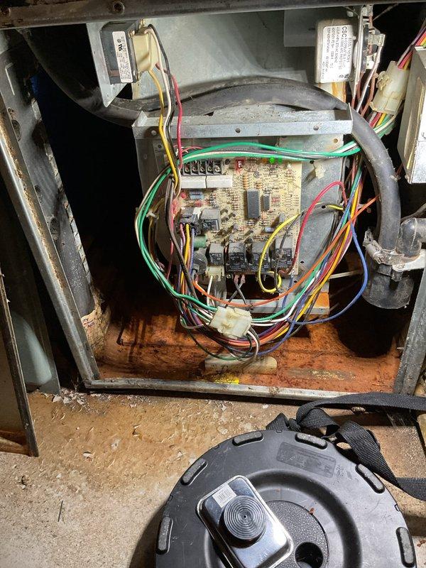 Diagnosed furnace issue in aging system (10+ years old) - confirmed circuit board failure evidenced by improper electrical signals and component damage visible upon inspection. System evaluation revealed extensive wear throughout with signs of corrosion on interior components and housing. Previous system replacement recommendation from 2022 was reinforced based on comprehensive assessment of deteriorated condition.