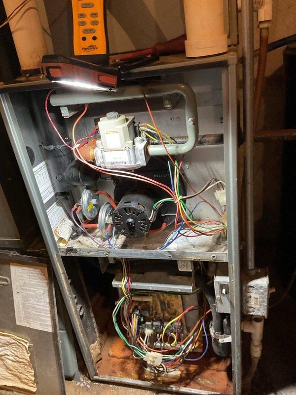 Diagnosed furnace issue in aging system (10+ years old) - confirmed circuit board failure evidenced by improper electrical signals and component damage visible upon inspection. System evaluation revealed extensive wear throughout with signs of corrosion on interior components and housing. Previous system replacement recommendation from 2022 was reinforced based on comprehensive assessment of deteriorated condition.