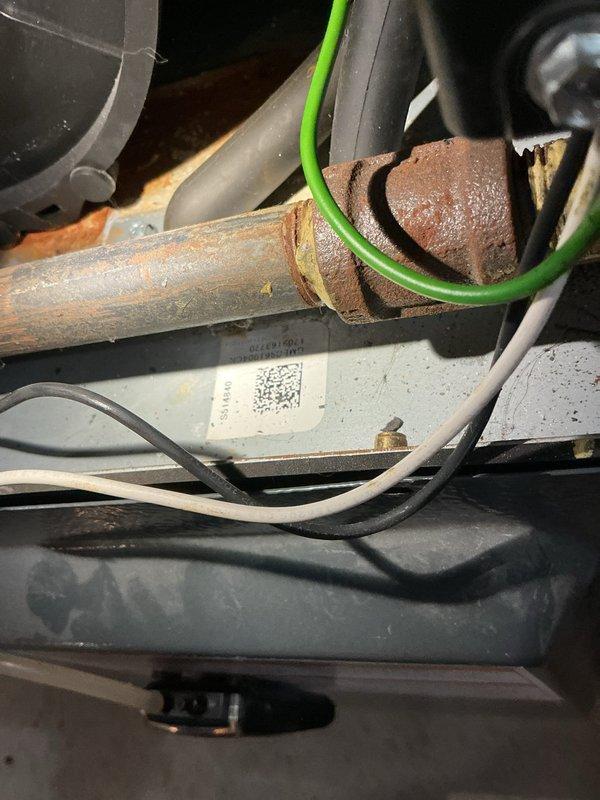 Responded to no-heat complaint on 2-stage gas furnace covered under parts and labor warranty. Diagnostic testing revealed open rollout switch caused by deteriorated burners with significant rust buildup. Replaced damaged burners to restore proper ignition sequence and safe operation of heating system.