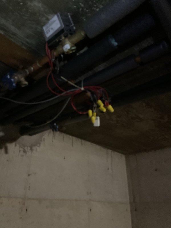 Responded to no heat complaint in apartment A while other zones were overheating. Discovered zone valve issue causing system imbalance with locked actuator. Rewired electrical connections to zone valve using appropriate wire nuts to restore proper zoning function, successfully resolving temperature inconsistencies throughout building.