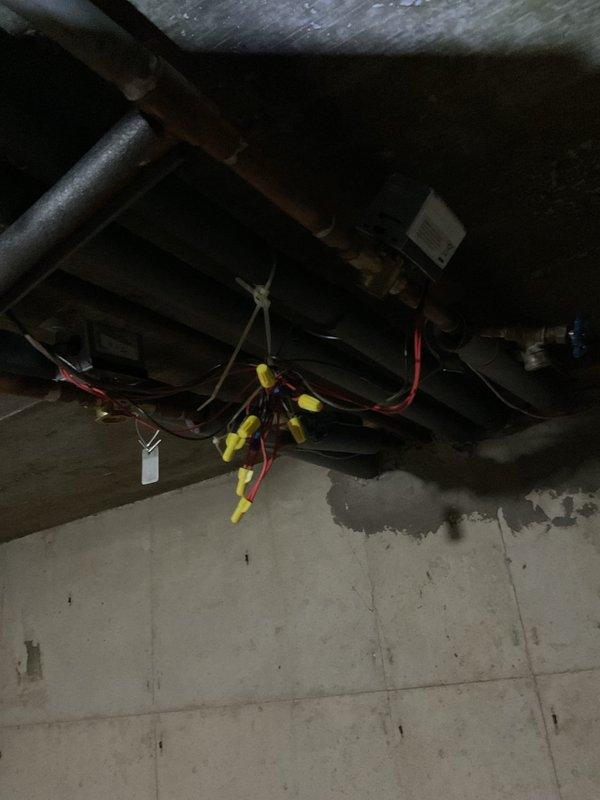 Responded to no heat complaint in apartment A while other zones were overheating. Discovered zone valve issue causing system imbalance with locked actuator. Rewired electrical connections to zone valve using appropriate wire nuts to restore proper zoning function, successfully resolving temperature inconsistencies throughout building.