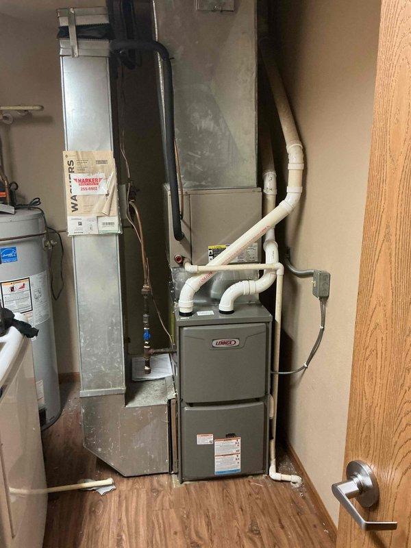 Performed follow-up service call at no charge to complete installation of fire damper link in residential Lennox HVAC system. Located and installed the fire damper in the vertical metal ductwork adjacent to furnace unit, using part that was previously tagged and held for this installation. System now properly configured with functional fire safety components.