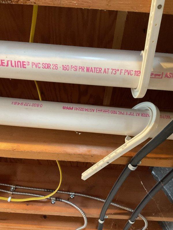 Conducted sales consultation for replacement of aging two-stage Armstrong gas belt furnace. Inspected existing installation environment, noting PVC plumbing runs and current thermostat setup (Honeywell digital displaying 66°F). Customer presented with options for new furnace system to replace the older unit.