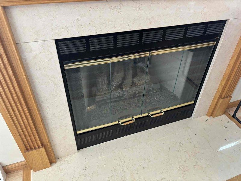 Performed routine maintenance inspection on Heatilator gas fireplace that had been inactive for several years with gas previously shut off. Completed full system check, restored gas supply, and successfully tested unit operation. Verified proper function of all components including ventilation system, glass doors, and decorative log set.
