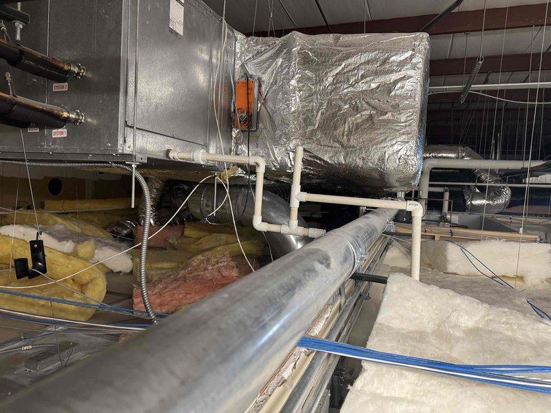 Responded to service call for furnace diagnosis at commercial property. Inspected ceiling-mounted HVAC system including main furnace unit, ductwork, and drainage components. Evaluated condition of insulation, electrical connections, and ventilation system to identify and address operational issues.