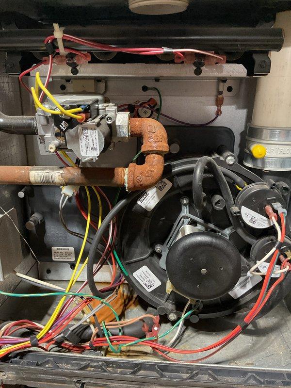 Responded to no-heat complaint on a 2000 York furnace. Diagnostic testing revealed a faulty gas valve which was preventing ignition. Removed access panels for thorough inspection of internal components including blower motor and control board. Replaced defective gas valve, restoring proper heating operation.