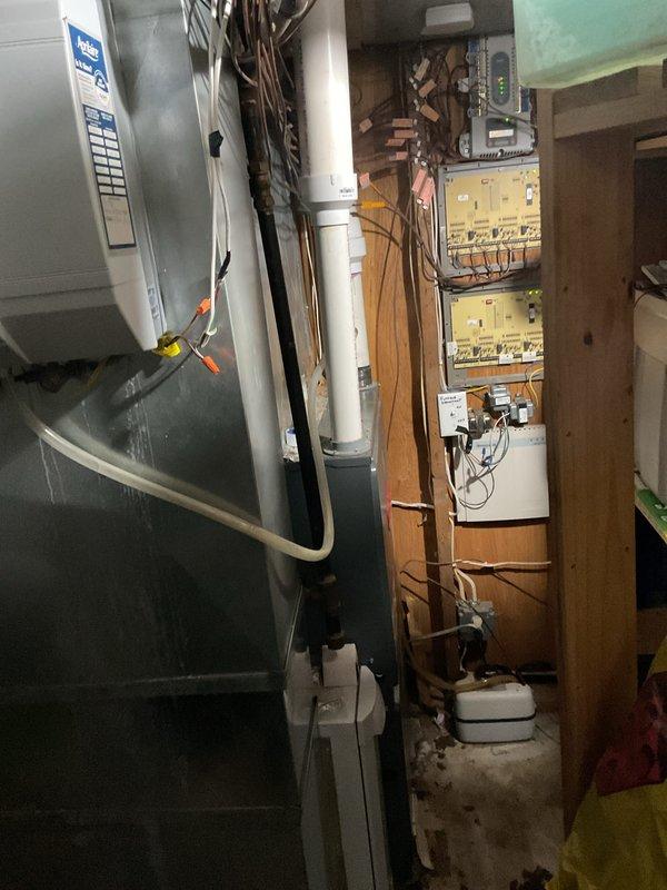 Responded to customer-reported E2 code on Goodman furnace with complete loss of heat. Residence temperature was 40°F despite thermostat setting of 65°F. Inspected Aprilaire unit and electrical connections in utility room, identified and corrected issue causing error code, and verified proper system operation before completion.