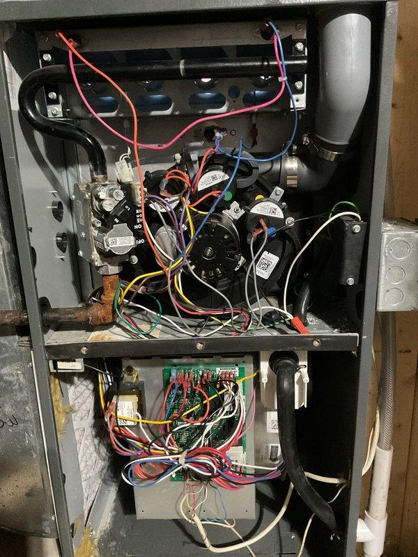 Replaced heat exchanger under warranty in customer's HVAC furnace. Performed complete disassembly of unit to access and remove failed exchanger, then installed new OEM component and reassembled furnace with all electrical connections properly restored. Tagged unit and documented repair with supporting photographs of internal components.
