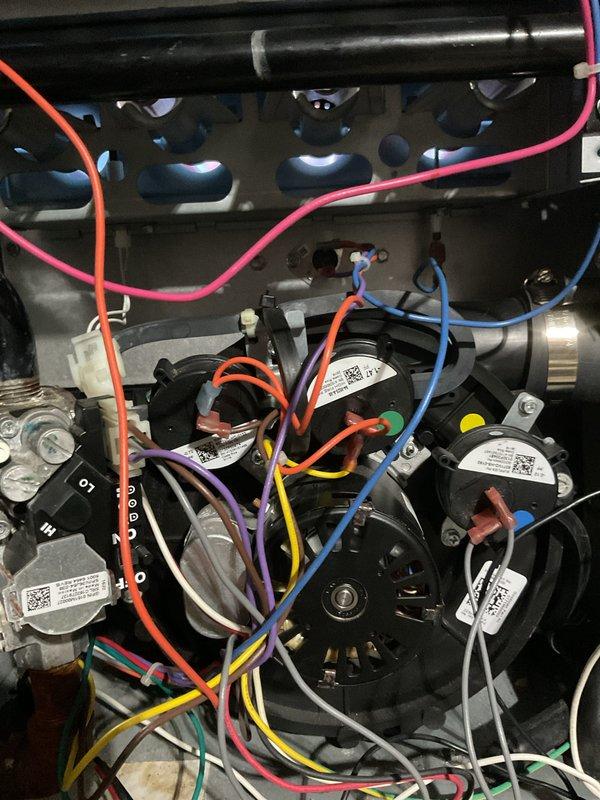 Replaced heat exchanger under warranty in customer's HVAC furnace. Performed complete disassembly of unit to access and remove failed exchanger, then installed new OEM component and reassembled furnace with all electrical connections properly restored. Tagged unit and documented repair with supporting photographs of internal components.