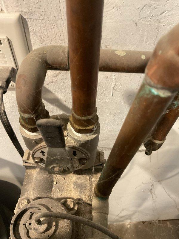 Responded to customer report of boiler issues after providing 30-minute advance notice. Upon inspection, discovered wet igniter wire and significant water leakage from the heat exchanger. Diagnostic assessment confirmed heat exchanger failure requiring complete replacement. Documented corrosion at pipe connections and visible water damage to surrounding wall area as supporting evidence.